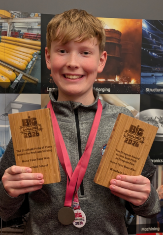 Picture of Zach holding his awards