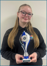 Picture of Grace holding an award