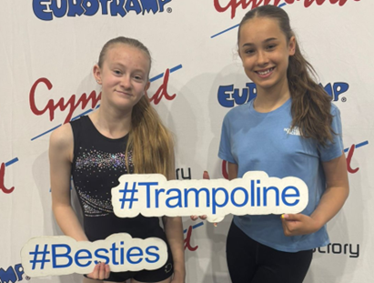 Photo of two students at a trampolining event