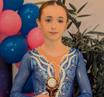 Isla holding her 3rd place trophy at North East Opens National British Ice Skating competition