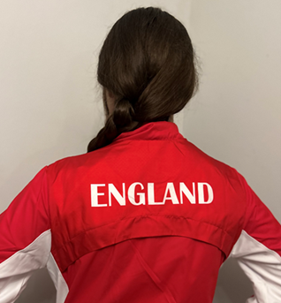Beau showing the back of her England shirt